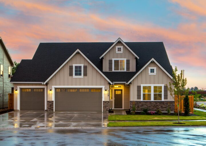 brown and gray painted house in front of road